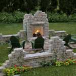 Outdoor folly featuring flagstone fireplace and seating nook.