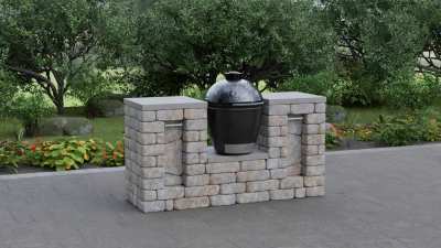 A modular outdoor kitchen island designed around a Kamado grill, providing a stable masonry base and a clean, functional layout for ceramic-style cooking.