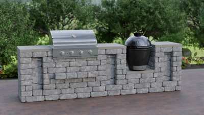 A modular outdoor kitchen grill island that combines a built-in gas grill and a Kamado smoker in one space-efficient masonry unit.